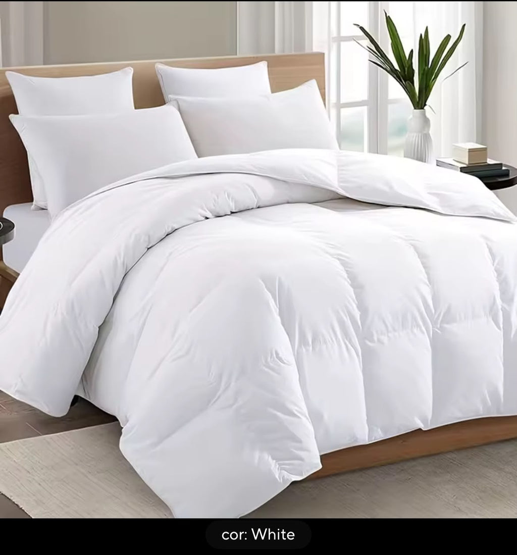 White comforter on bed