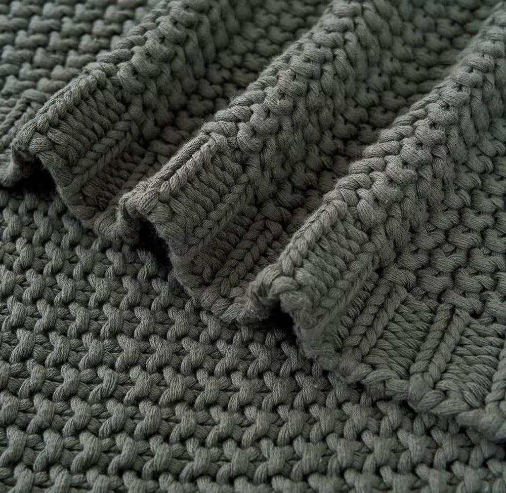 Chunky knit throw blanket caramel orange folded stacked