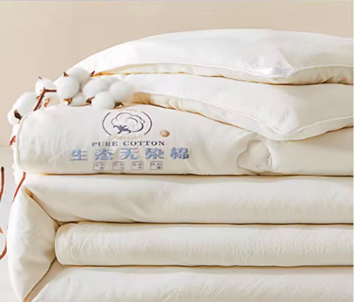 Luxury pure cotton duvet folded with natural cotton flowers