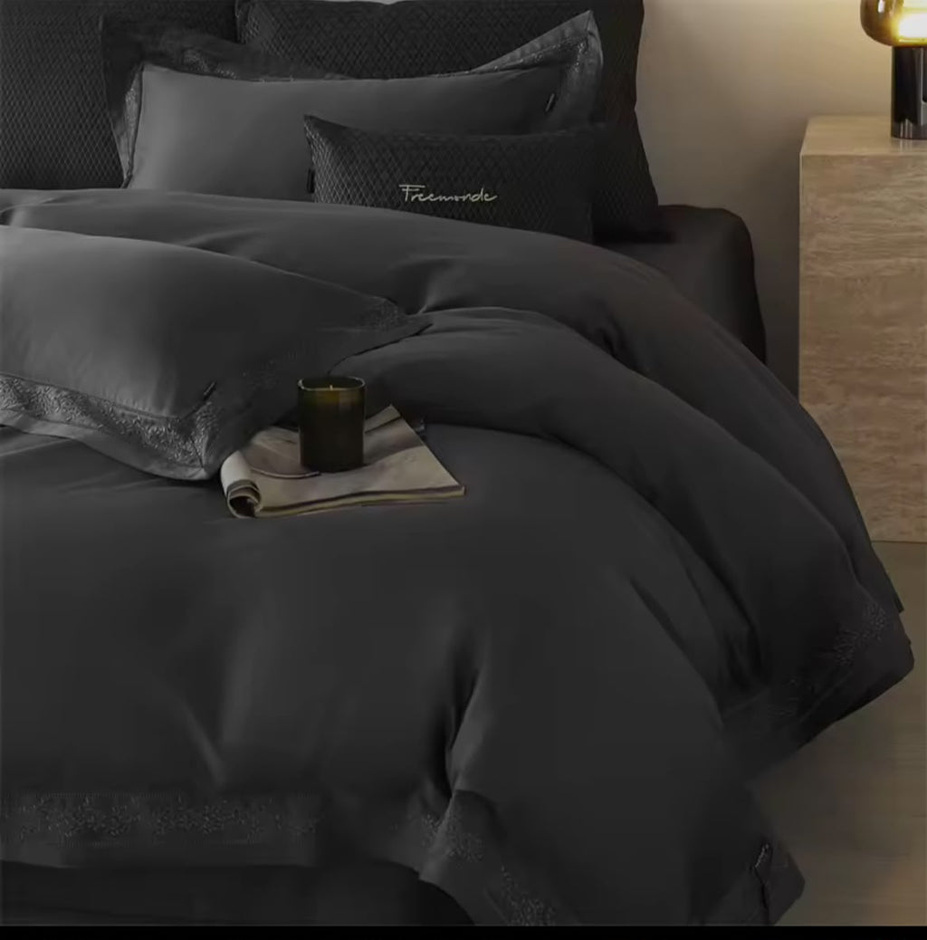 Dark charcoal Egyptian cotton bedding set with embroidery warm ambient lighting