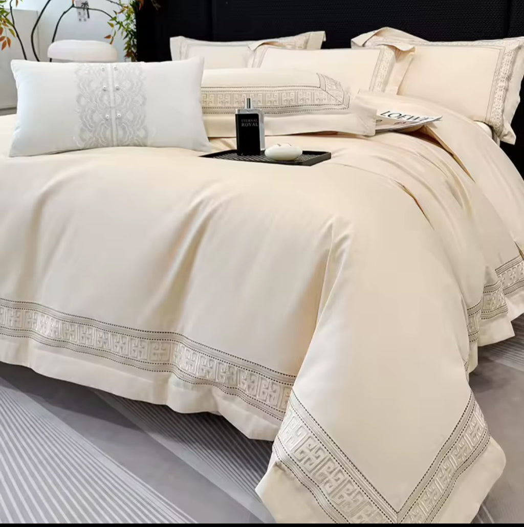 Champagne beige Egyptian cotton duvet cover draped over king bed with decorative white cushion – full view