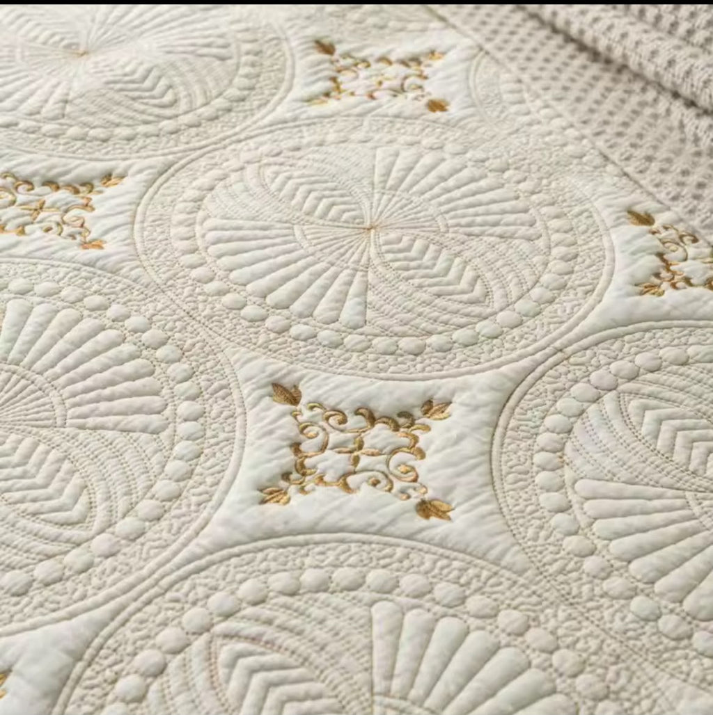 Close-up detail of white cotton quilted embroidered bedspread corner fold