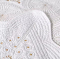 Cream embroidered cotton bedspread set with pillowcases on bed beige headboard