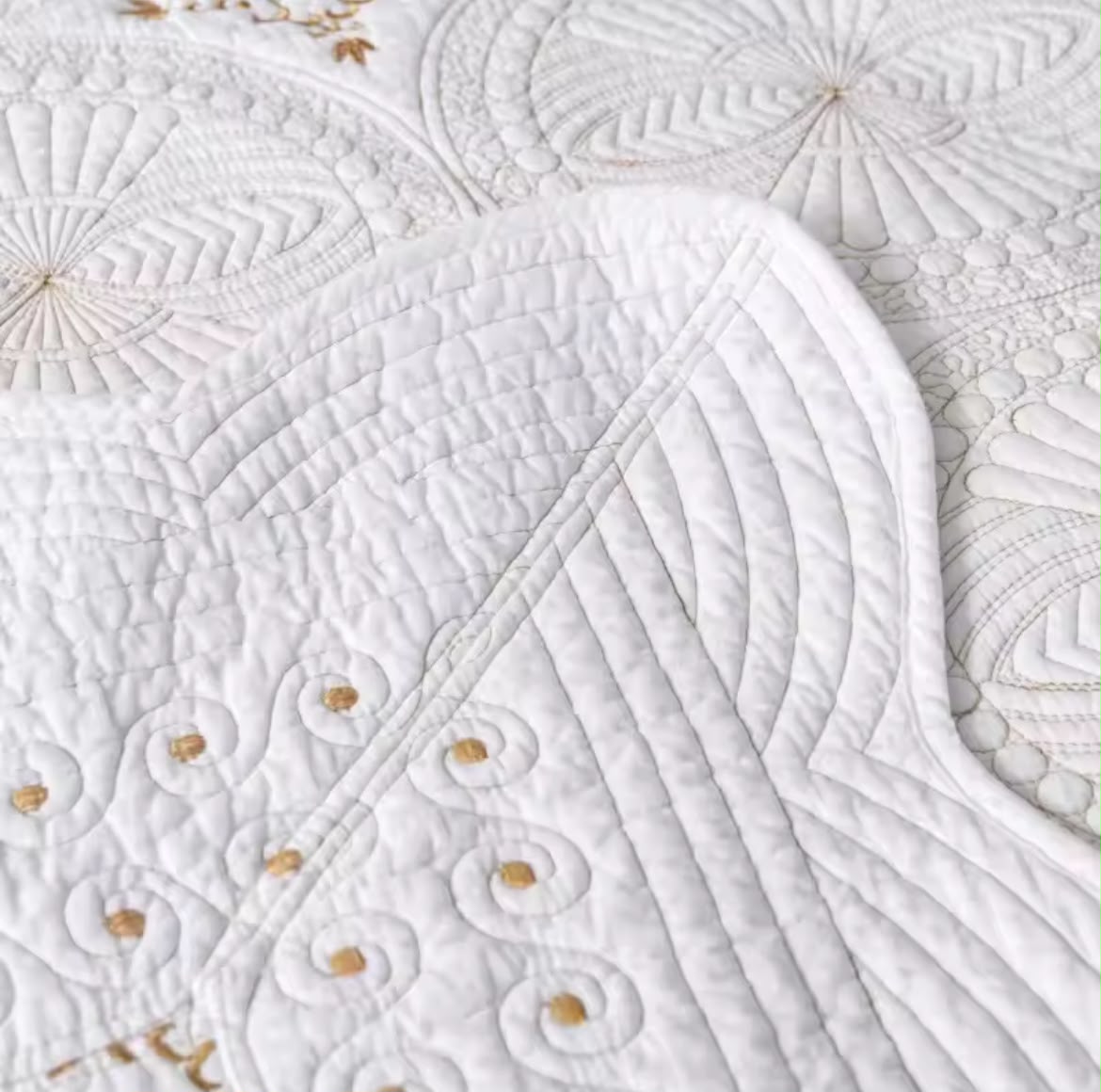 Cream embroidered cotton bedspread set with pillowcases on bed beige headboard